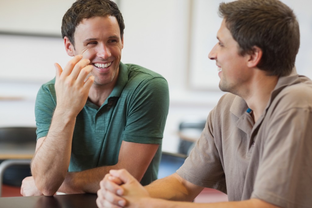 A gay couple is having a conversation about HIV prevention methods.