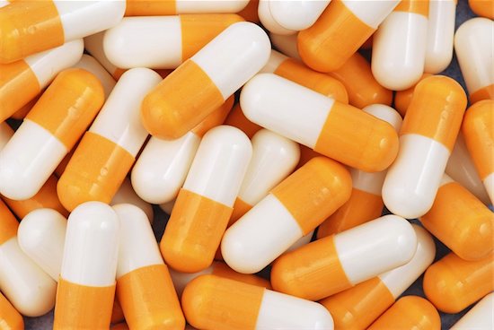 Several orange and white antiretroviral drugs.