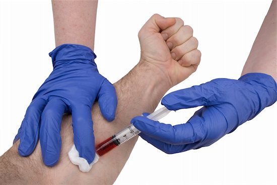 A doctor is drawing blood from a patients arm, prepping for treatment for HIV.
