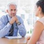 A doctor talking to his patient about their diagnosis, and early HIV intervention.